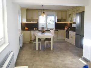 Visiting Deni's Home – two-level lime kitchen with painted details and a cleaner modern living room, photo 3