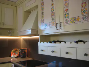 Visiting Deni's Home – two-level lime kitchen with painted details and a cleaner modern living room, photo 5