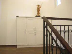 Visiting Deni's Home – two-level lime kitchen with painted details and a cleaner modern living room, photo 12